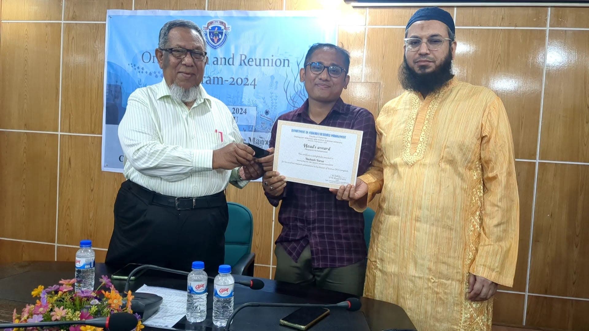 Uachash Barua receiving the Head’s Award for Research Achievement from the Department of Fisheries Resource Management at CVASU in 2024